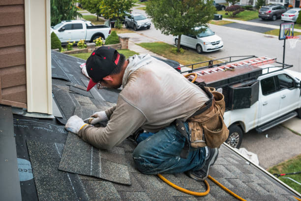 Professional Roof Replacement technician working in Hills, IA